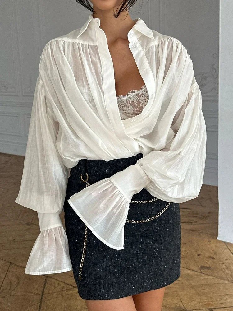 Brielle genomskinlig blus med knappar