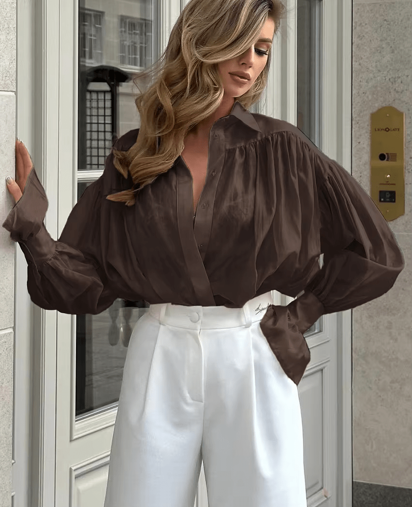 Brielle genomskinlig blus med knappar