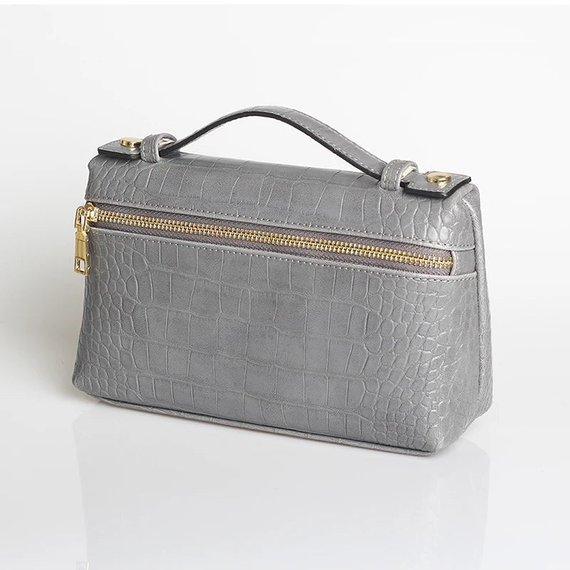 Minerva-clutch med krokodillemønster