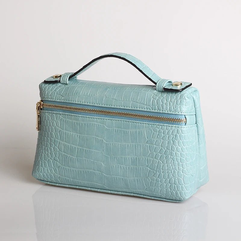 Minerva-clutch med krokodillemønster
