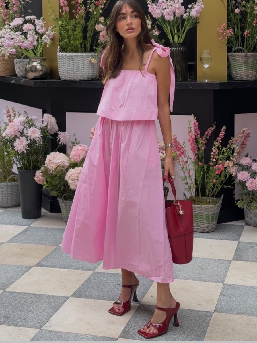 Abito midi rosa Sophia con fiocco e balze