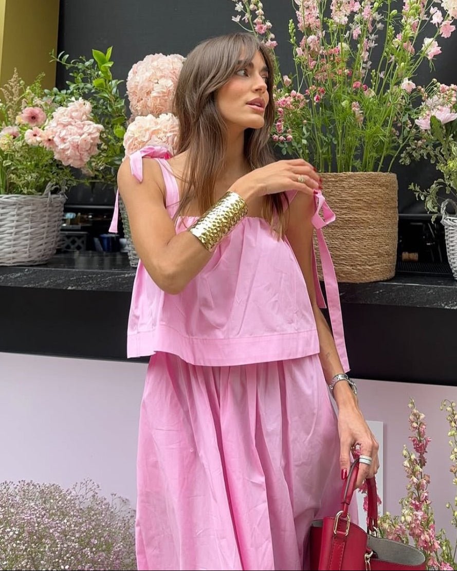 Abito midi rosa Sophia con fiocco e balze