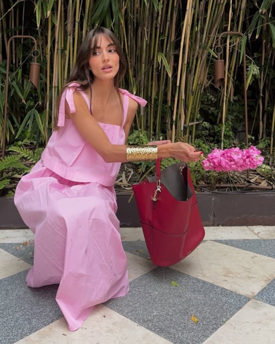 Abito midi rosa Sophia con fiocco e balze