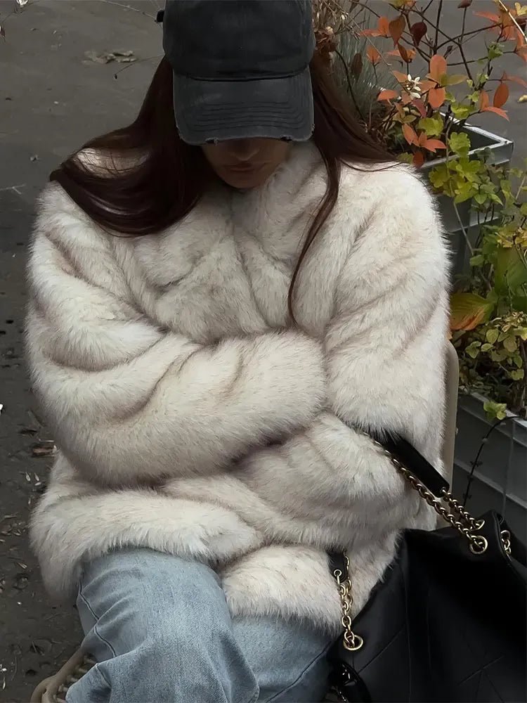 Tilda kåpe i imitert pels